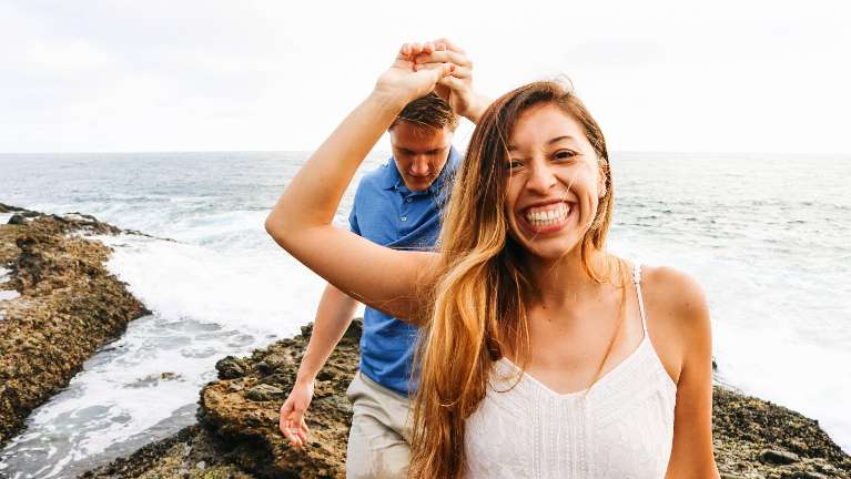 Couple on beach walk | Narre Warren Dentist