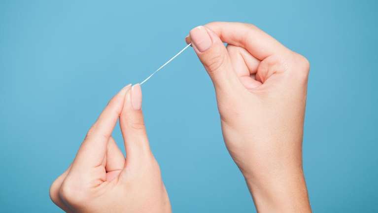 person using floss in narre warren