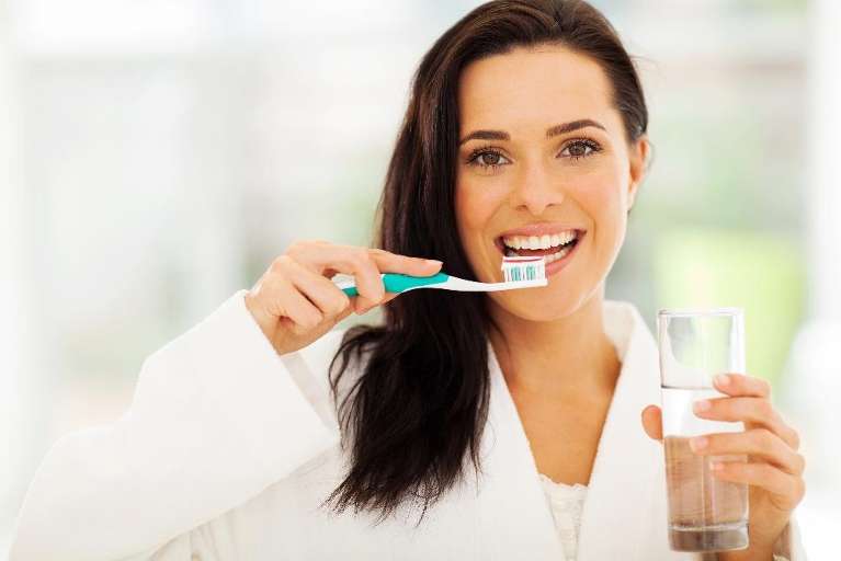 dentist narre warren | woman brushing teeth
