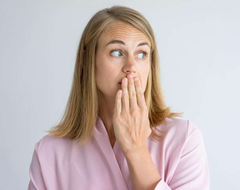 woman hiding her smile in narre warren